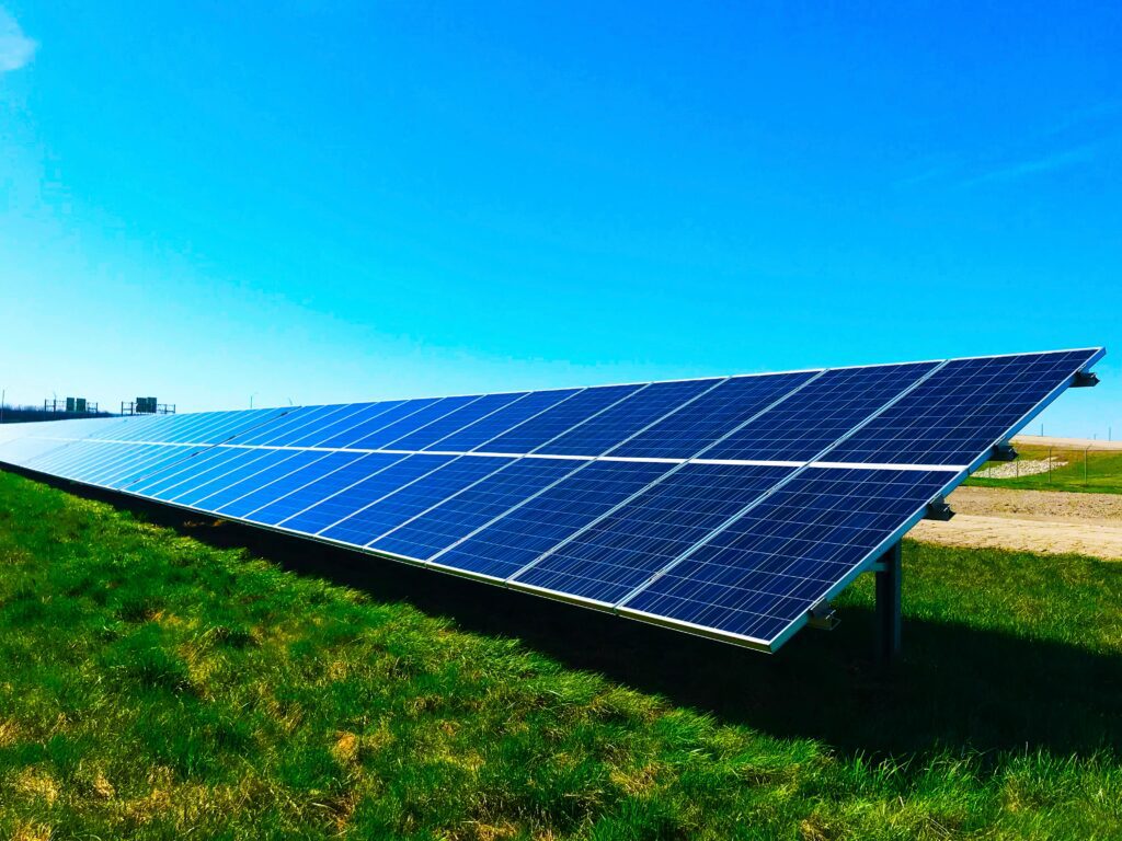 Blue solar panels on the grass under the California sun