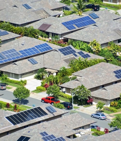 Overhead-view of multiple rooftops with solar panels